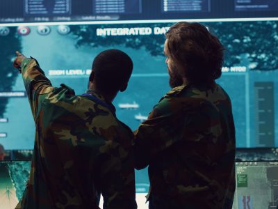 diverse team of military personnel examining gathered information